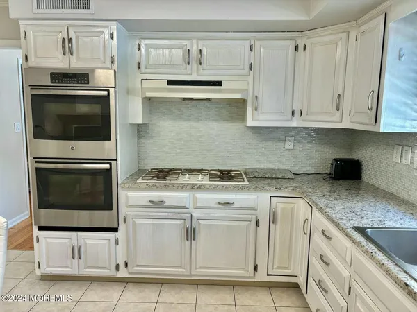 a bed sitting in a room and table