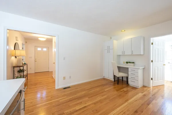a view of a kitchen cabinets and wooden floor