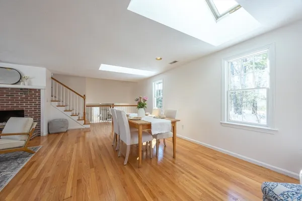 a view of a dining room with furniture window and wooden floor