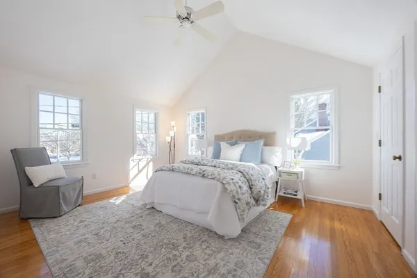 a bedroom with a bed and a chair