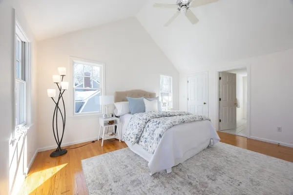 a bed room with a bed and a chandelier