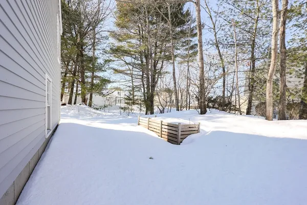 a view of patio with snow on the road