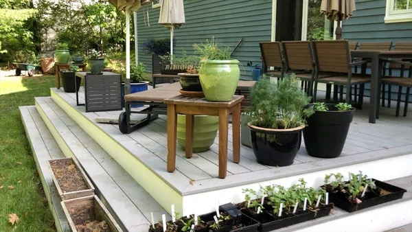 a view of an outdoor sitting area with furniture