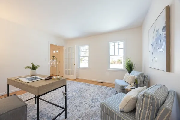 a living room with furniture and window