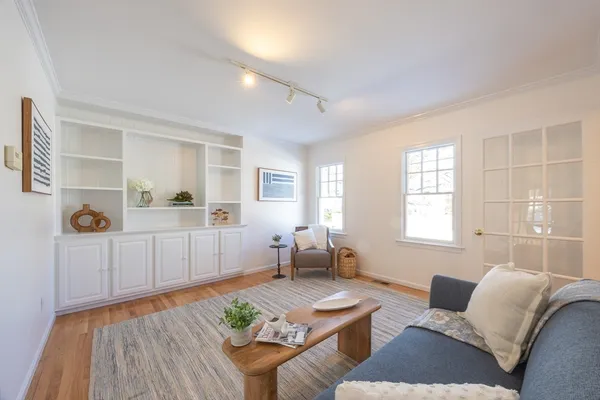 a living room with furniture and a table