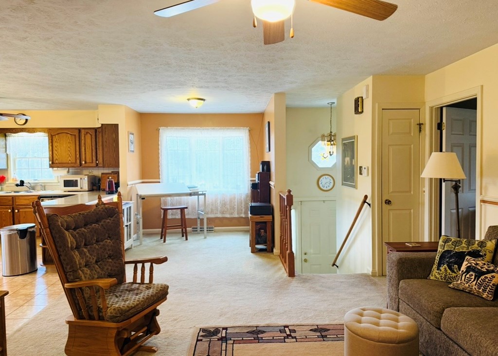879 Kahle Road Summerville, PA 15864 - Photo 11 of 38 a living room with furniture a large window and potted plants