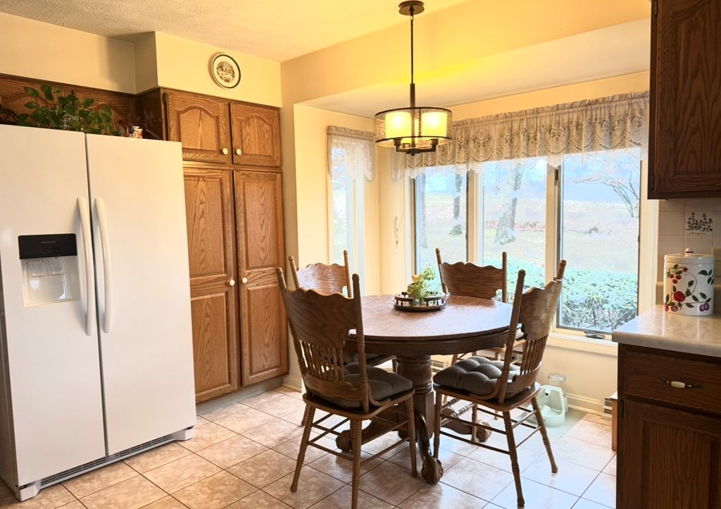 879 Kahle Road Summerville, PA 15864 - Photo 14 of 38 a view of a dining room with furniture window and wooden floor