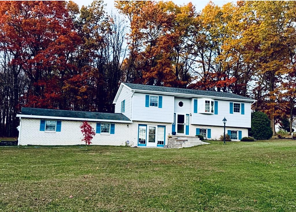 879 Kahle Road Summerville, PA 15864 - Photo 2 of 38 a front view of a house with a garden