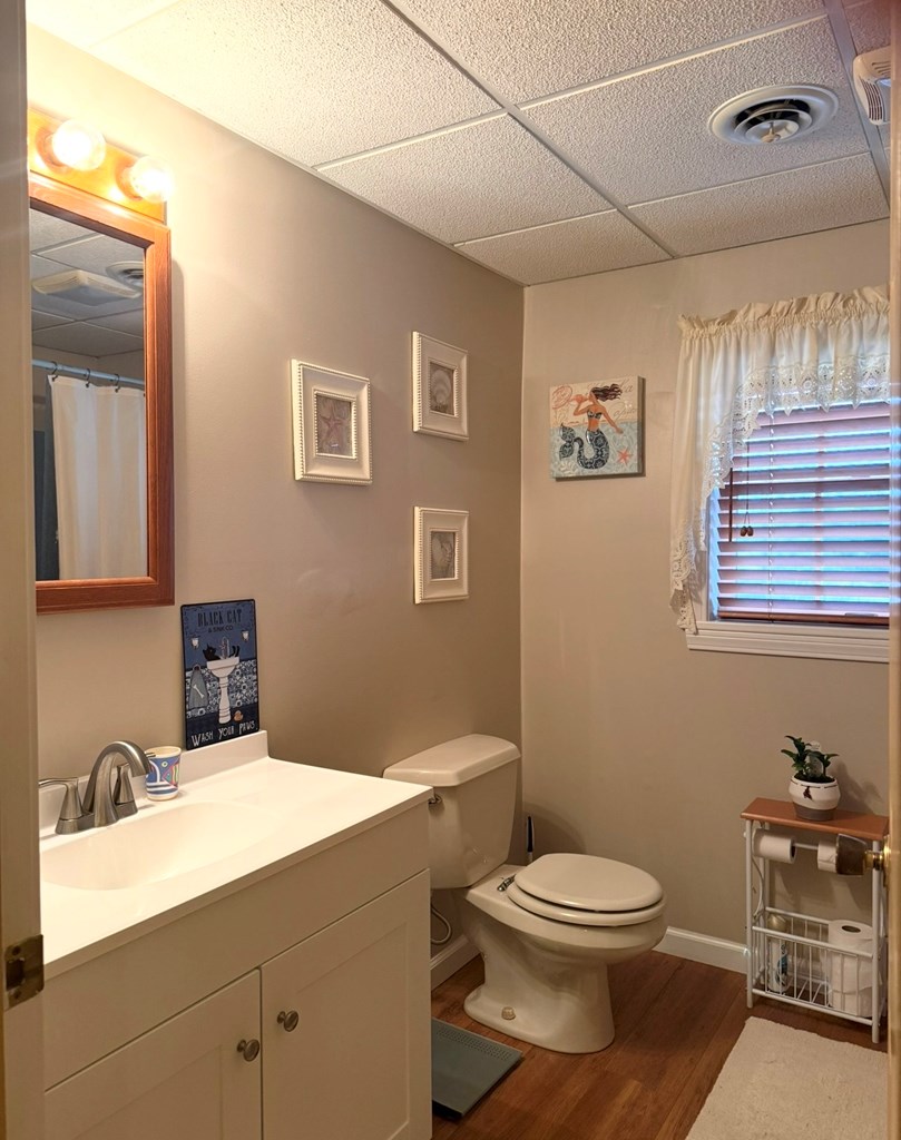 879 Kahle Road Summerville, PA 15864 - Photo 24 of 38 a bathroom with a toilet a sink and mirror