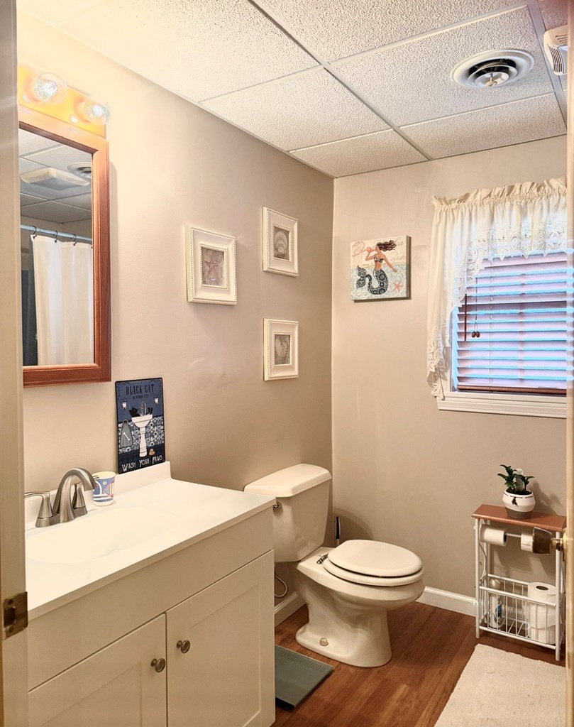 879 Kahle Road Summerville, PA 15864 - Photo 25 of 38 a bathroom with a toilet a sink and mirror