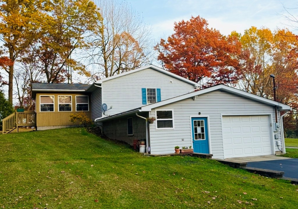 879 Kahle Road Summerville, PA 15864 - Photo 4 of 38 a front view of a house with a garden