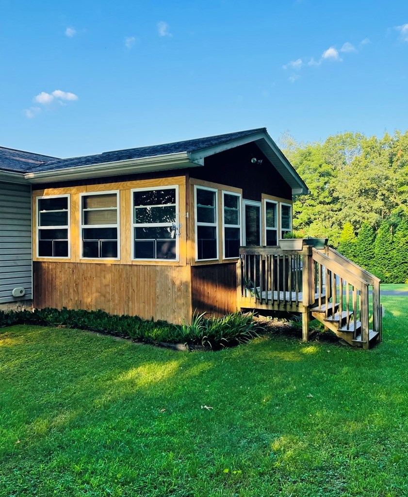 879 Kahle Road Summerville, PA 15864 - Photo 7 of 38 a view of a house with a yard and deck