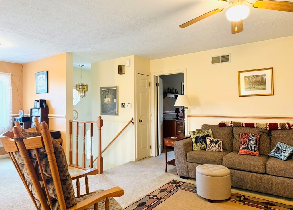 879 Kahle Road Summerville, PA 15864 - Photo 10 of 38 a living room with furniture and a floor to ceiling window