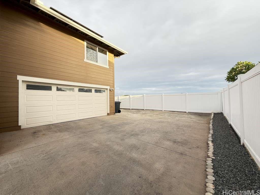 94-1027 Halekapio Street Waipahu, HI 96797 - Photo 13 of 13 a view of a house with garage
