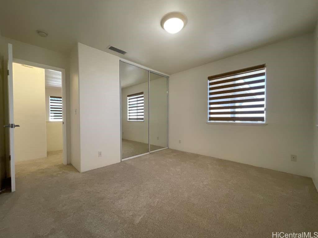 94-1027 Halekapio Street Waipahu, HI 96797 - Photo 9 of 13 an empty room with windows