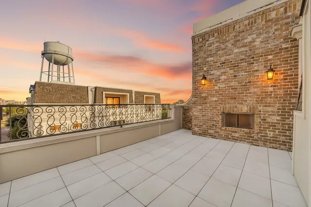 a outdoor living space with furniture and a fireplace