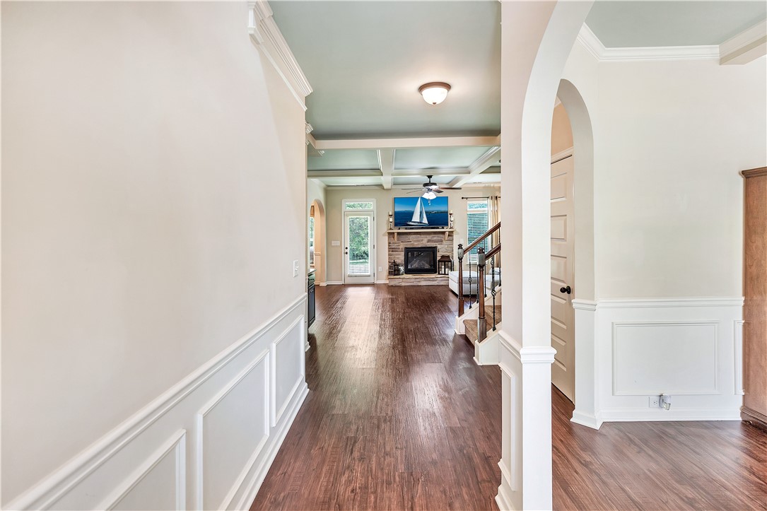 144 Buckland Drive Anderson, SC 29621 - Photo 45 of 48 Rich hardwood floors welcome guests into this open-concept home with a cozy fireplace.