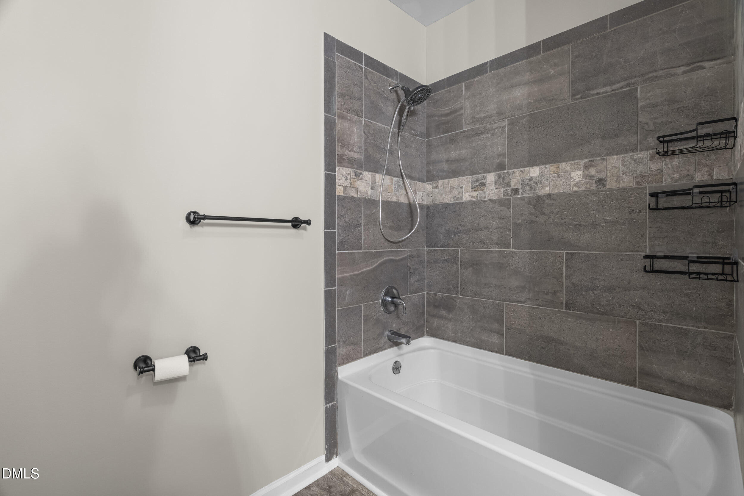307 East J Street Erwin, NC 28339 - Photo 13 of 27 a bathroom with a bathtub