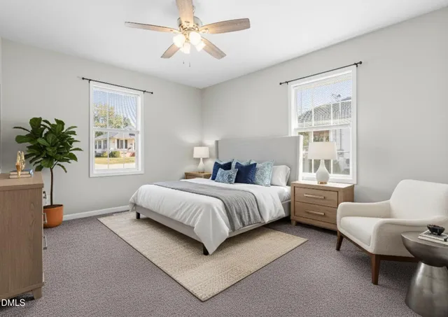 a spacious bedroom with a bed and a couch