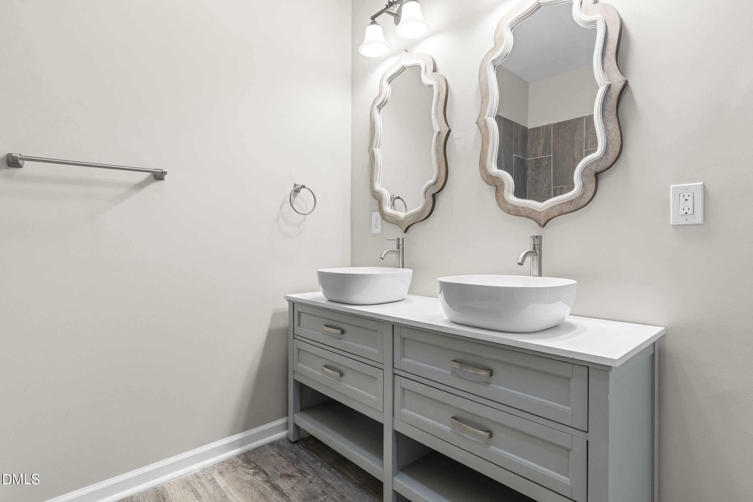307 East J Street Erwin, NC 28339 - Photo 16 of 27 a bathroom with a sink and a mirror