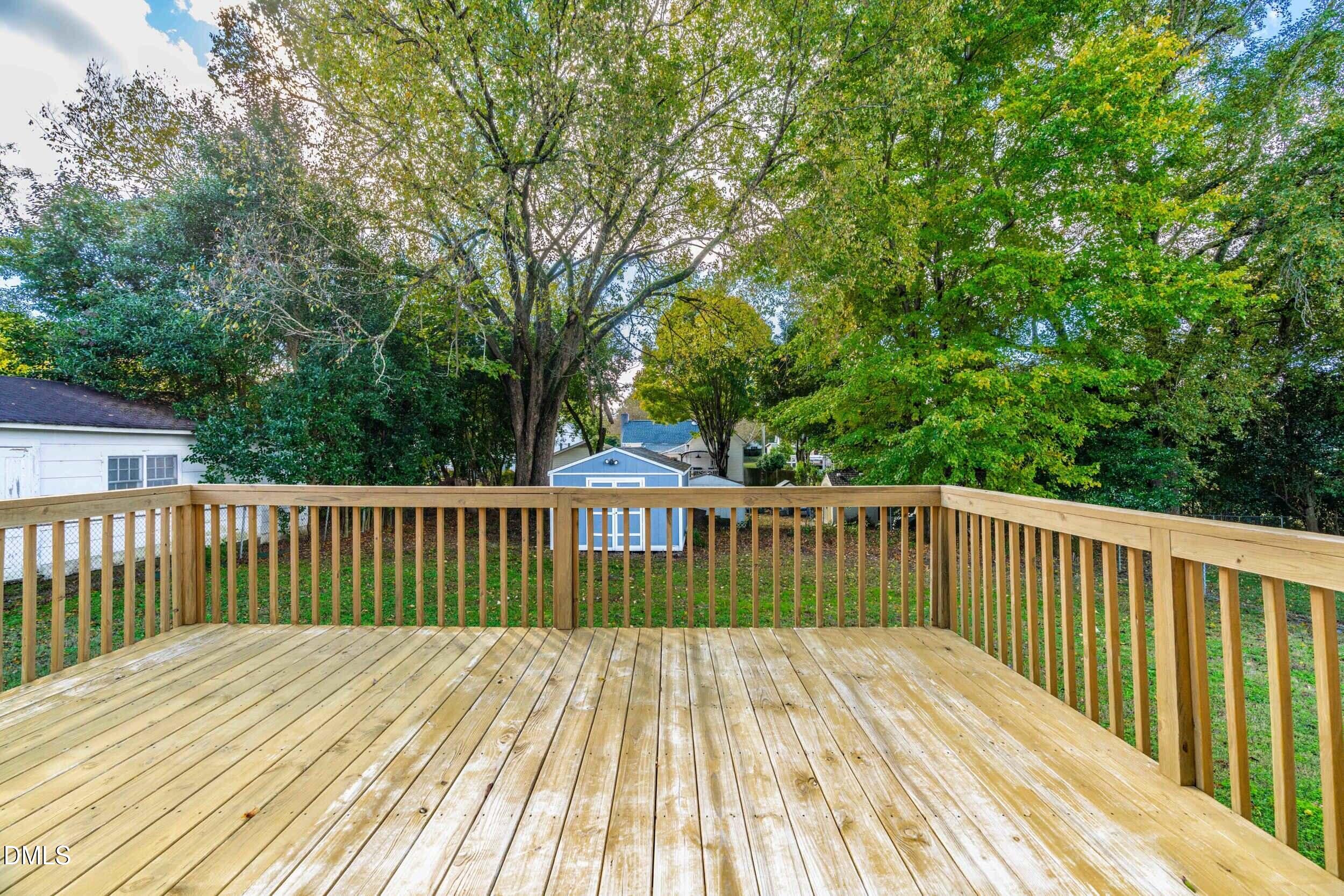 307 East J Street Erwin, NC 28339 - Photo 22 of 27 a view of wooden deck and a backyard