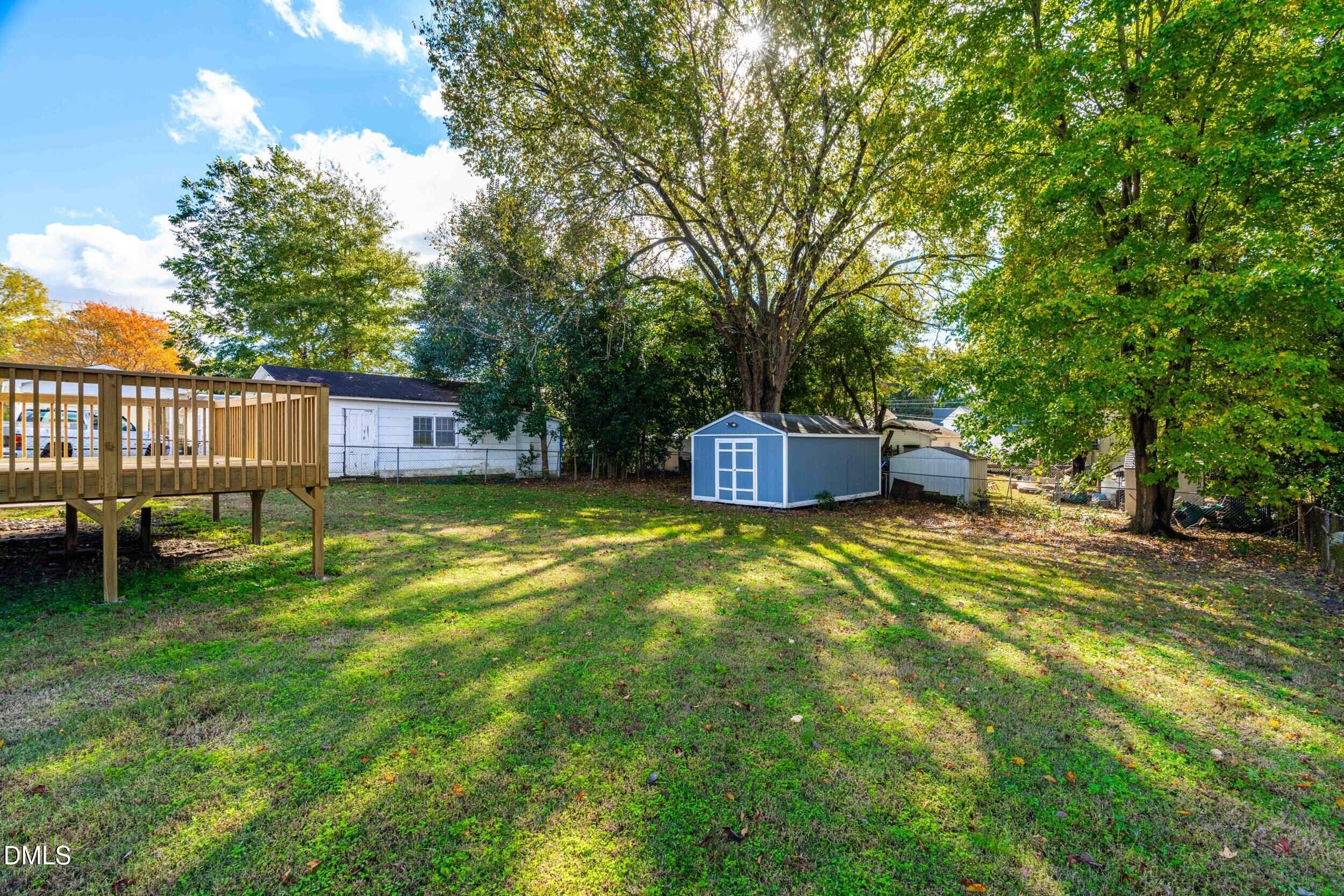 307 East J Street Erwin, NC 28339 - Photo 24 of 27 a swimming pool with outdoor seating and yard