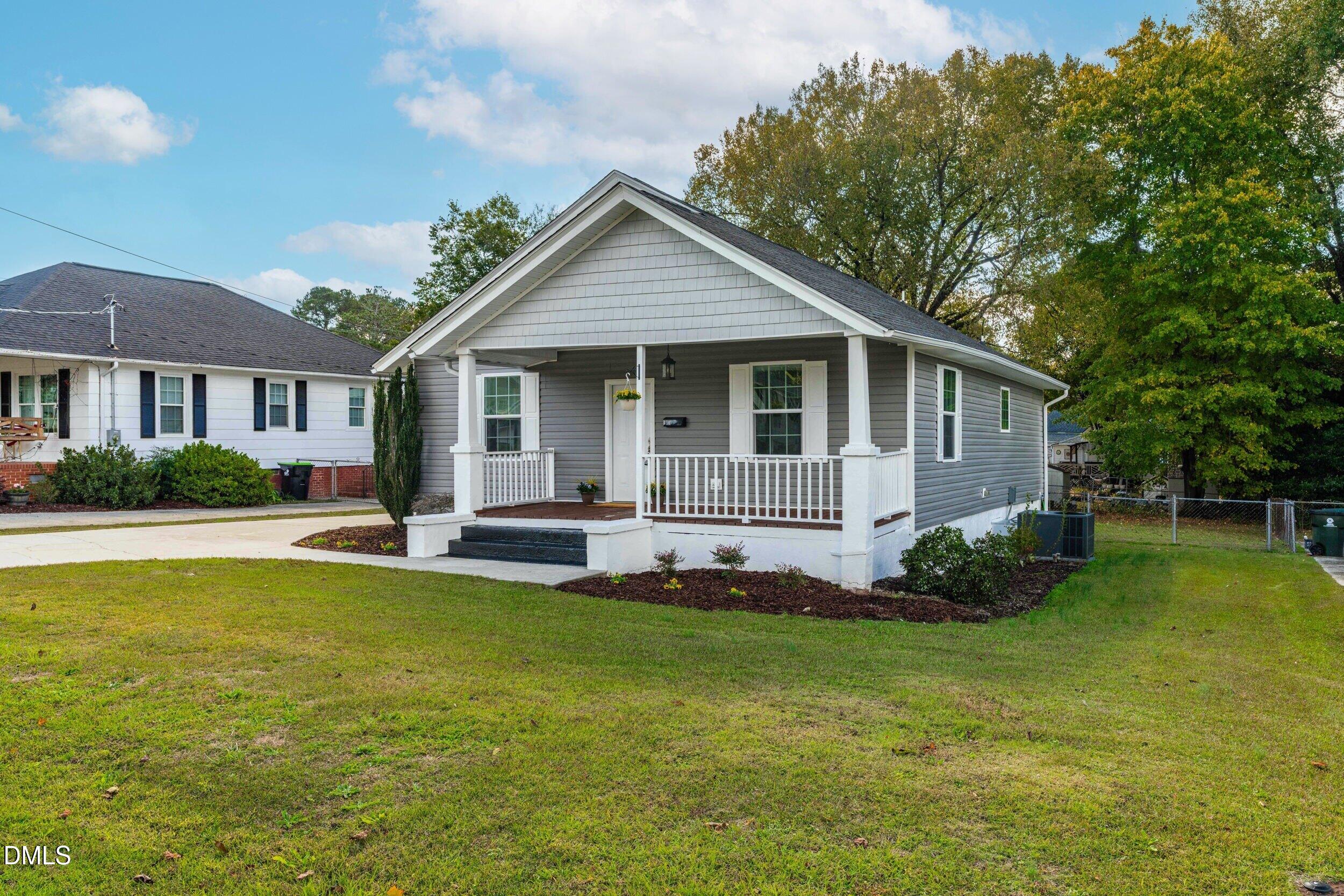 307 East J Street Erwin, NC 28339 - Photo 3 of 27 a view of a house with a swimming pool
