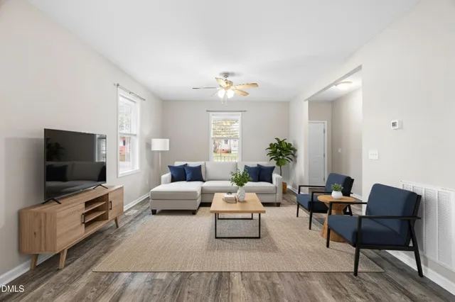 a living room with furniture and a flat screen tv
