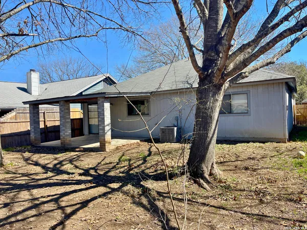a house with trees in the background