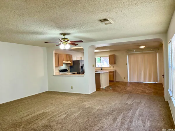 a view of a kitchen with a sink and cabinet area