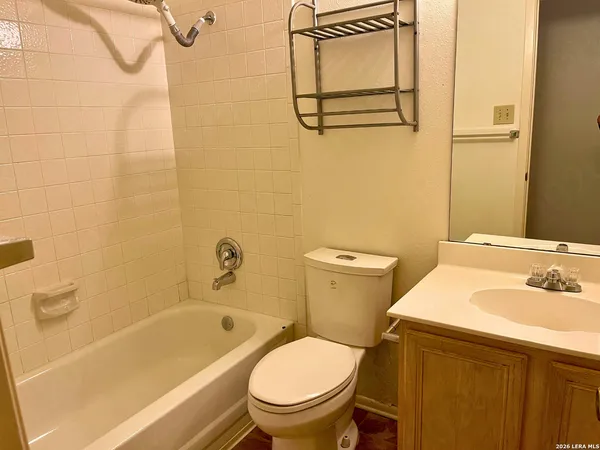 a bathroom with a sink a toilet and a bathtub