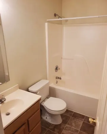 a bathroom with a toilet a sink and a bathtub