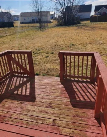 a view of wooden floor with a lake view