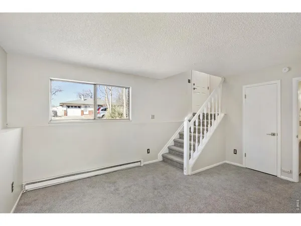 a view of a livingroom with stairs
