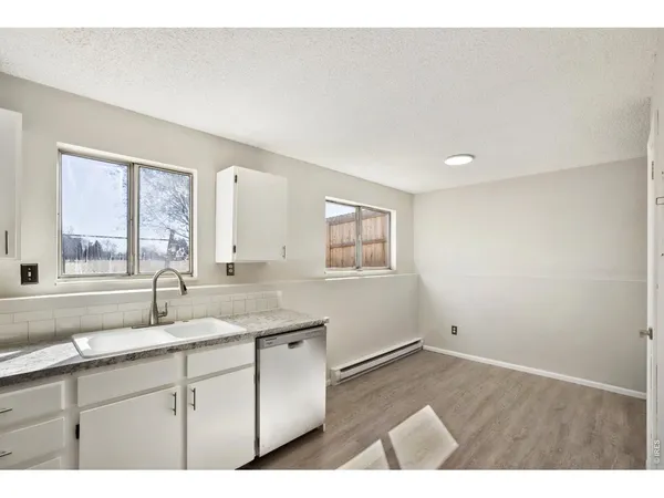 a bathroom with a sink and a window