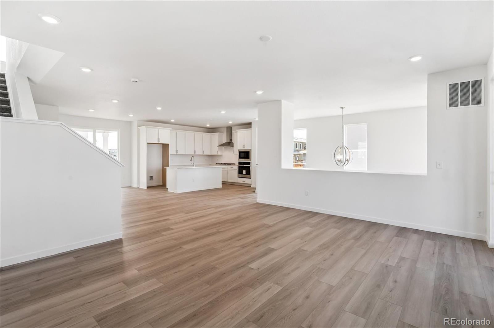 9123 White Ridge Road Englewood, CO 80112 - Photo 12 of 28 a view of kitchen and wooden floor