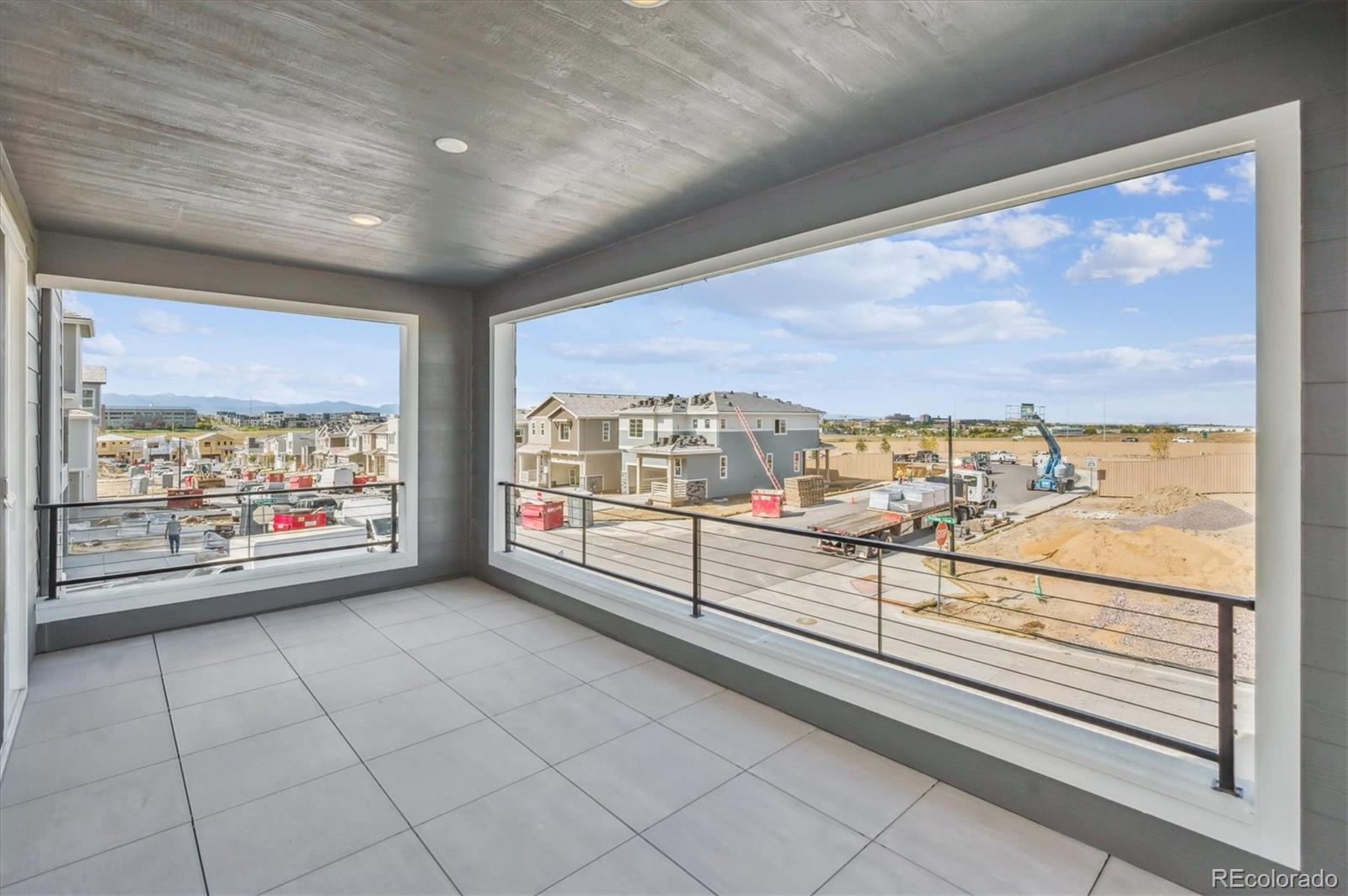 9123 White Ridge Road Englewood, CO 80112 - Photo 13 of 28 a view of an empty room with a floor to ceiling window and an outdoor view