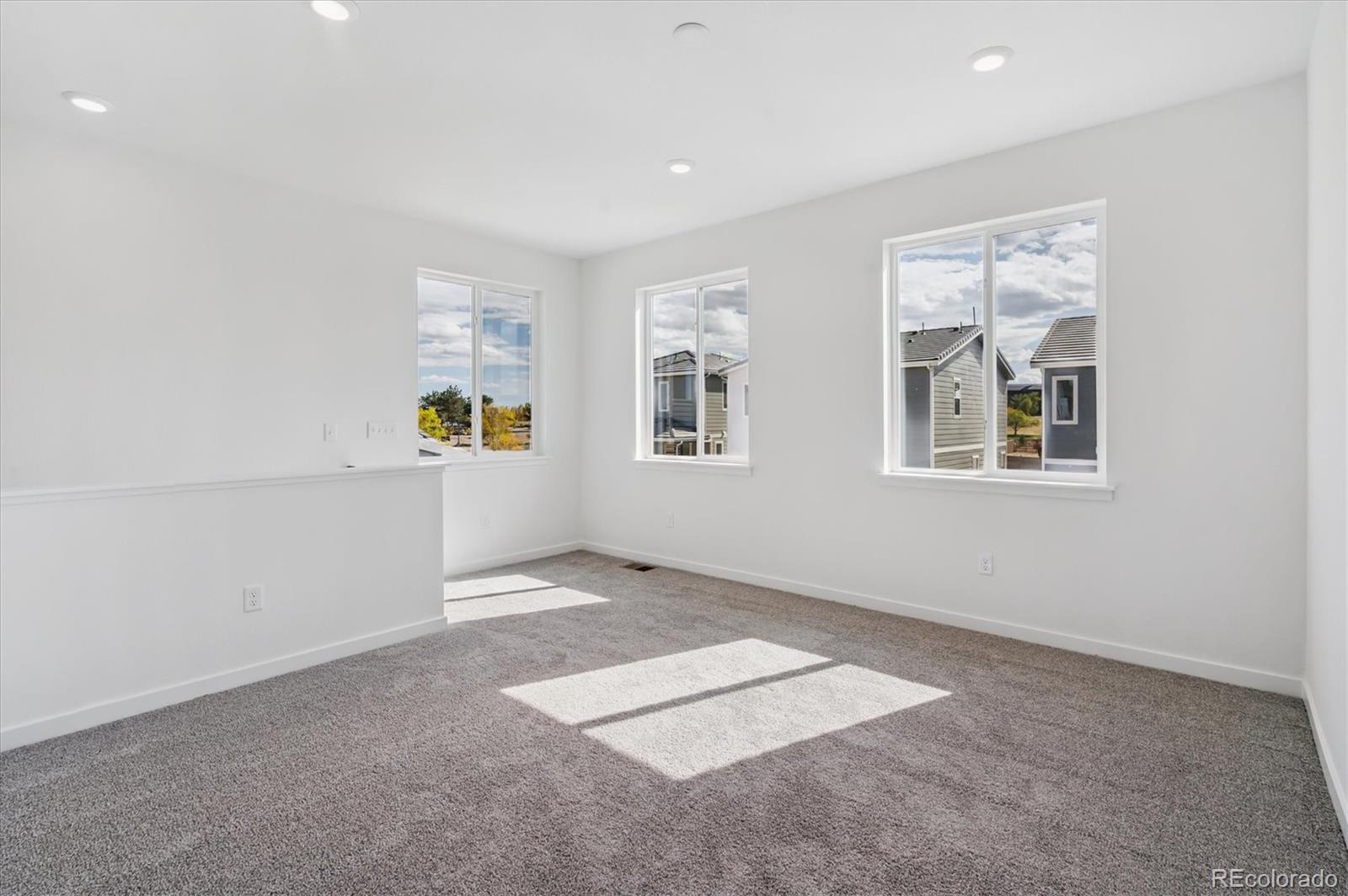 9123 White Ridge Road Englewood, CO 80112 - Photo 15 of 28 a view of an empty room with a window