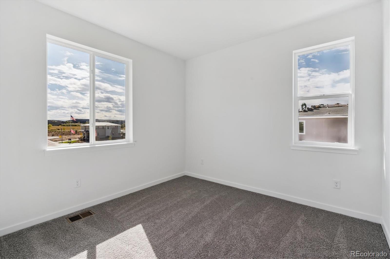 9123 White Ridge Road Englewood, CO 80112 - Photo 16 of 28 a view of an empty room with a window