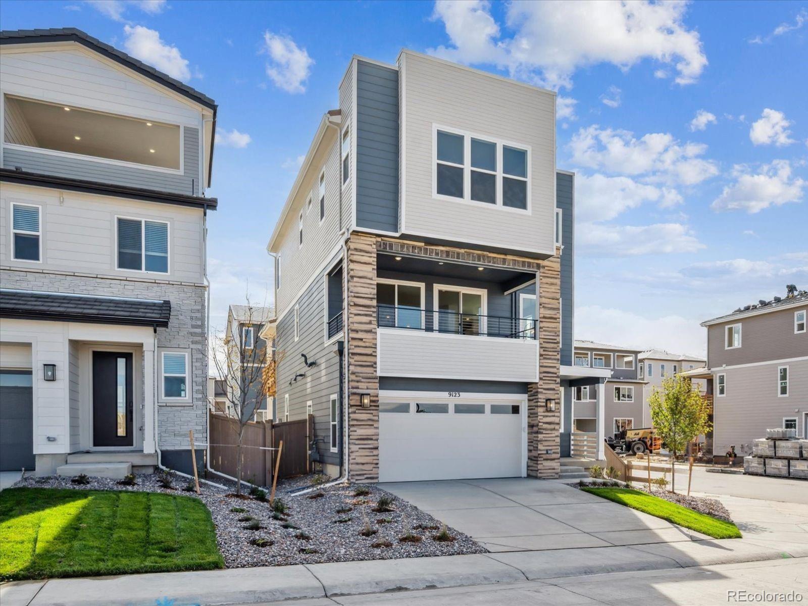 9123 White Ridge Road Englewood, CO 80112 - Photo 2 of 28 a view of a patio with couches chairs and potted plants