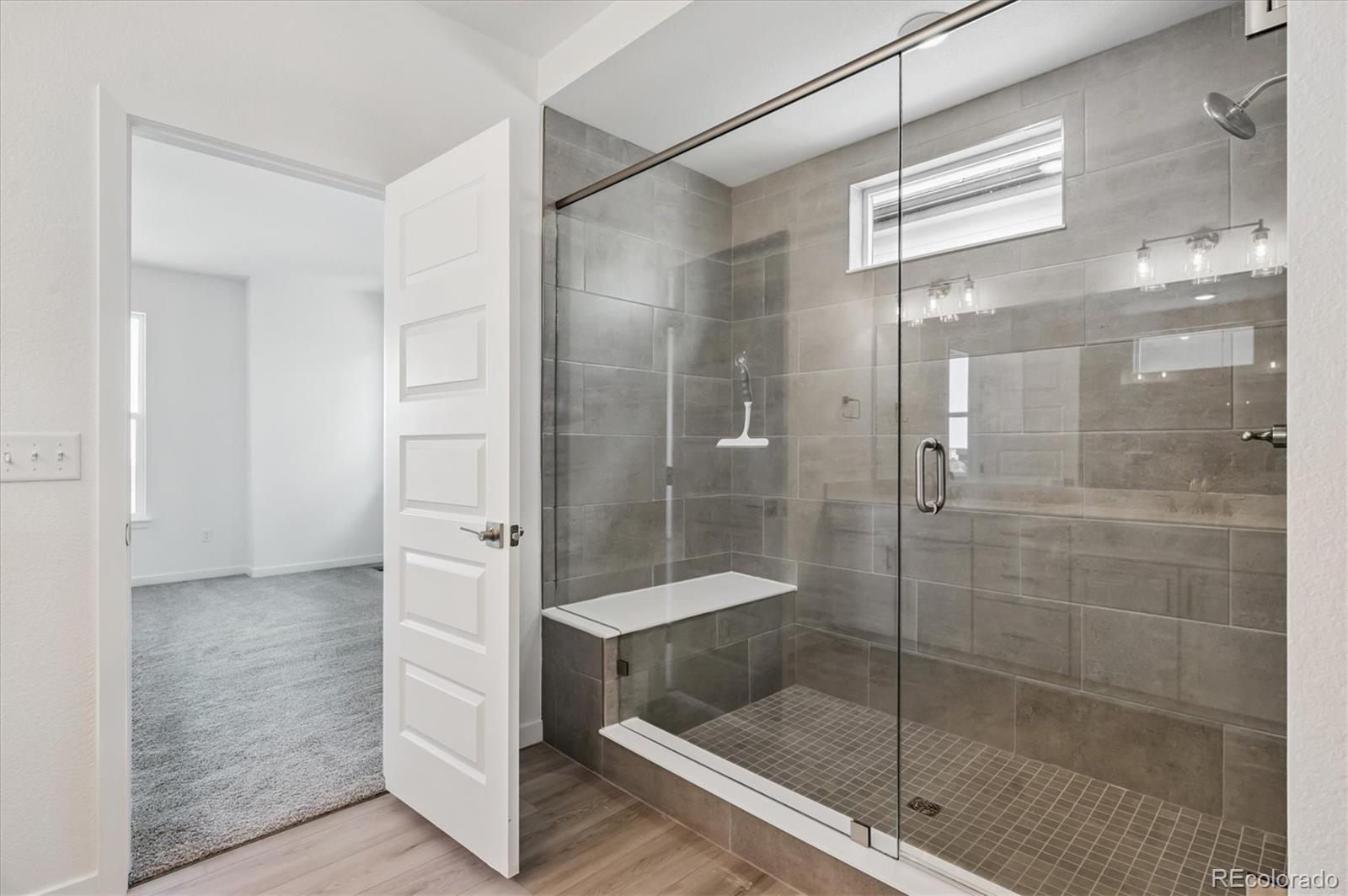 9123 White Ridge Road Englewood, CO 80112 - Photo 23 of 28 a bathroom with a shower