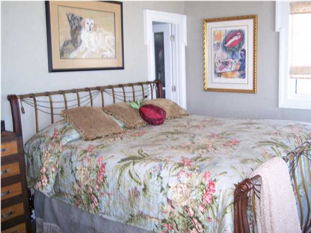 260 Wall Street Inlet Beach, FL 32461 - Photo 16 of 18 a bedroom with a bed and a painting on the wall