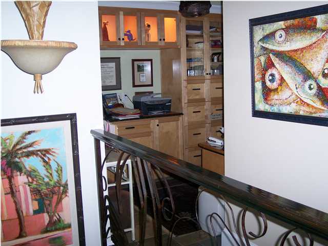 260 Wall Street Inlet Beach, FL 32461 - Photo 18 of 18 a view of a hallway with wooden floor and a painting on the wall