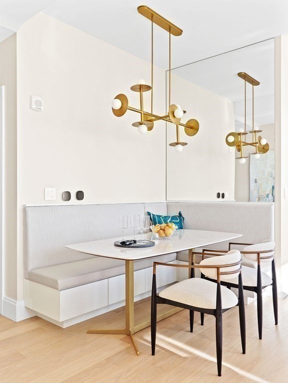 380 Harrison Avenue, Unit 14E Boston, MA 02118 - Photo 5 of 29 a dining room with furniture and a chandelier