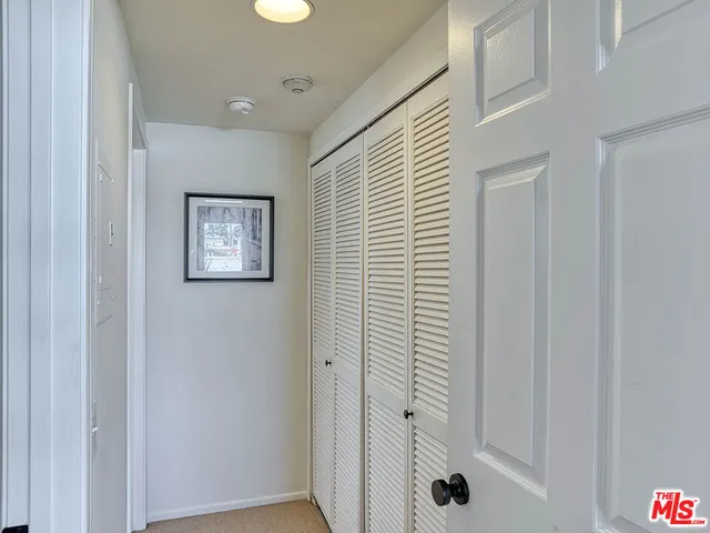 a view of a hallway with closet