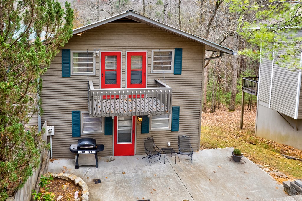 96 Clubhouse Court Ellijay, GA 30536 - Photo 16 of 56 a front view of a house with patio