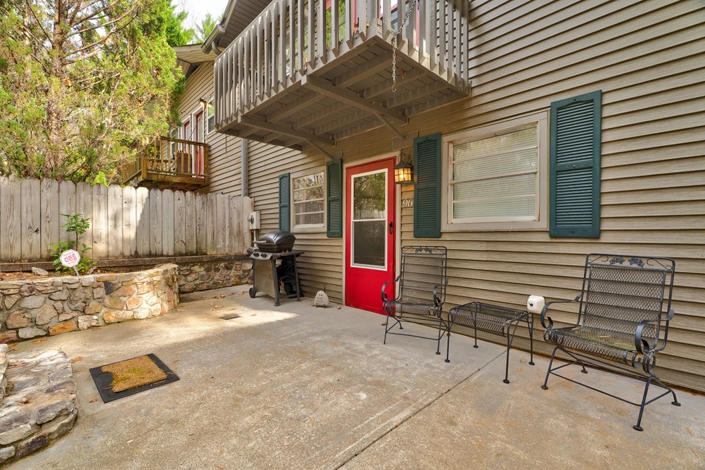96 Clubhouse Court Ellijay, GA 30536 - Photo 22 of 56 a view of backyard with a table and chairs and wooden fence