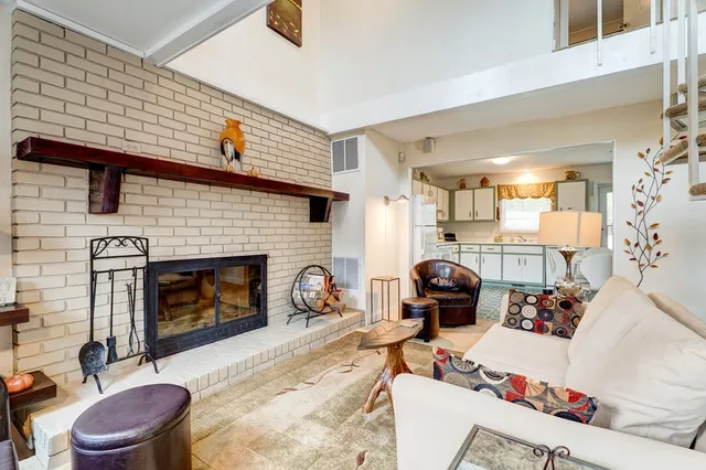a view of a livingroom with furniture and a potted plant