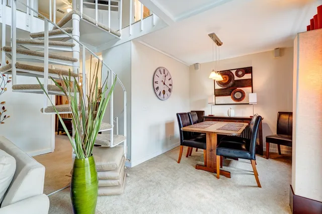 a dining room with furniture and window