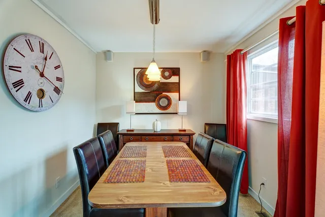 a balcony with table and chairs